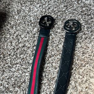 Both Gucci Belts One Red,Green,Black the other is straight Black an Silver
